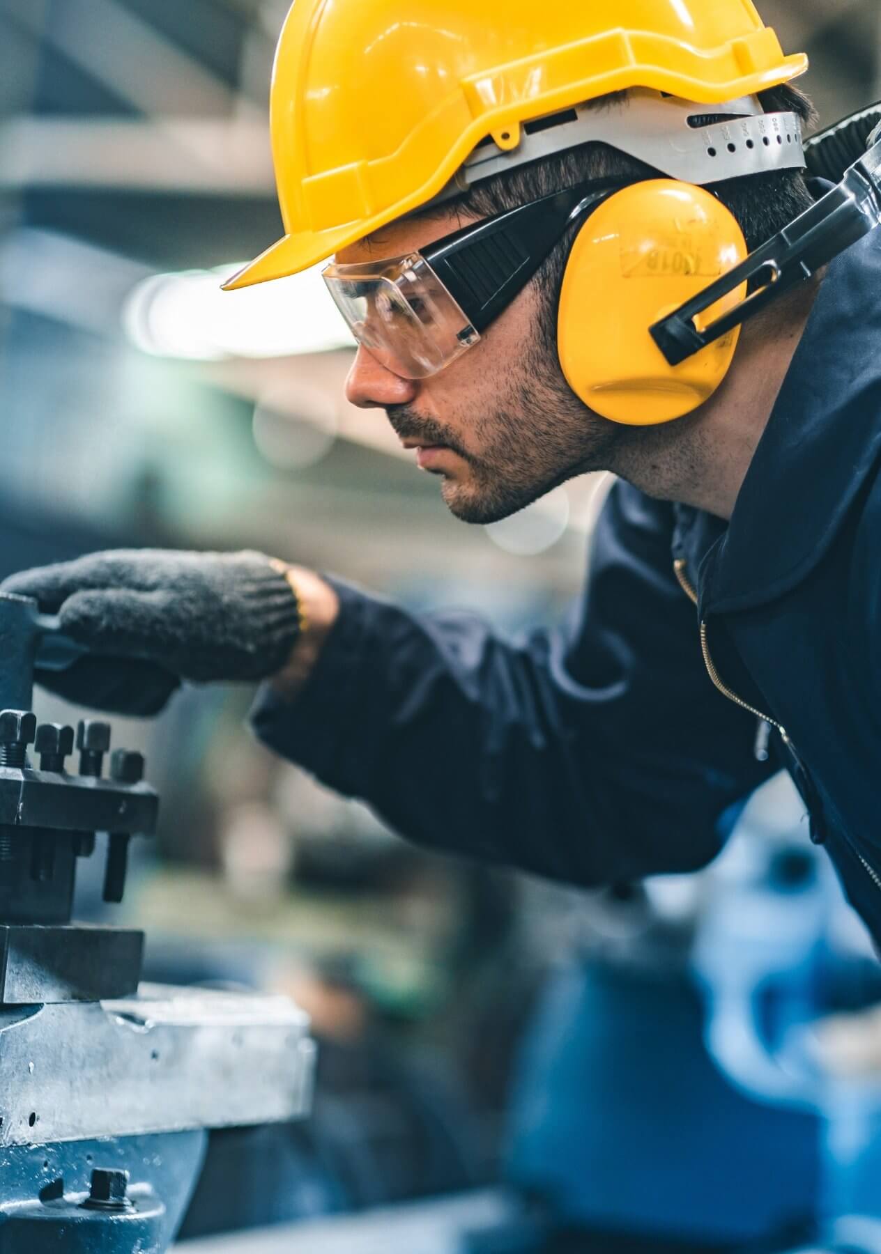 A person wearing a helmet and protective eyewear