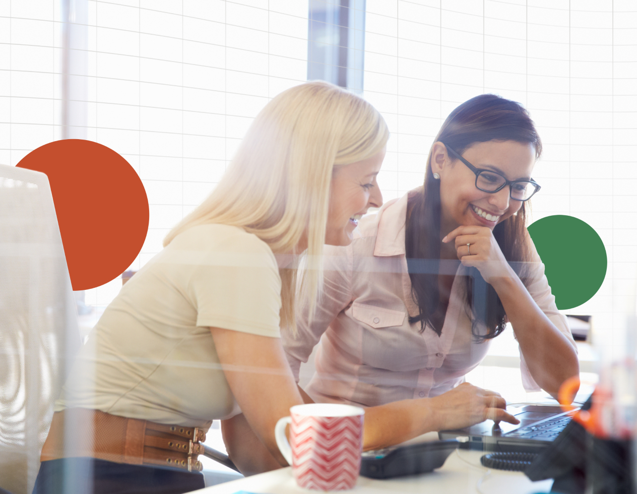 Image of two women working in an office