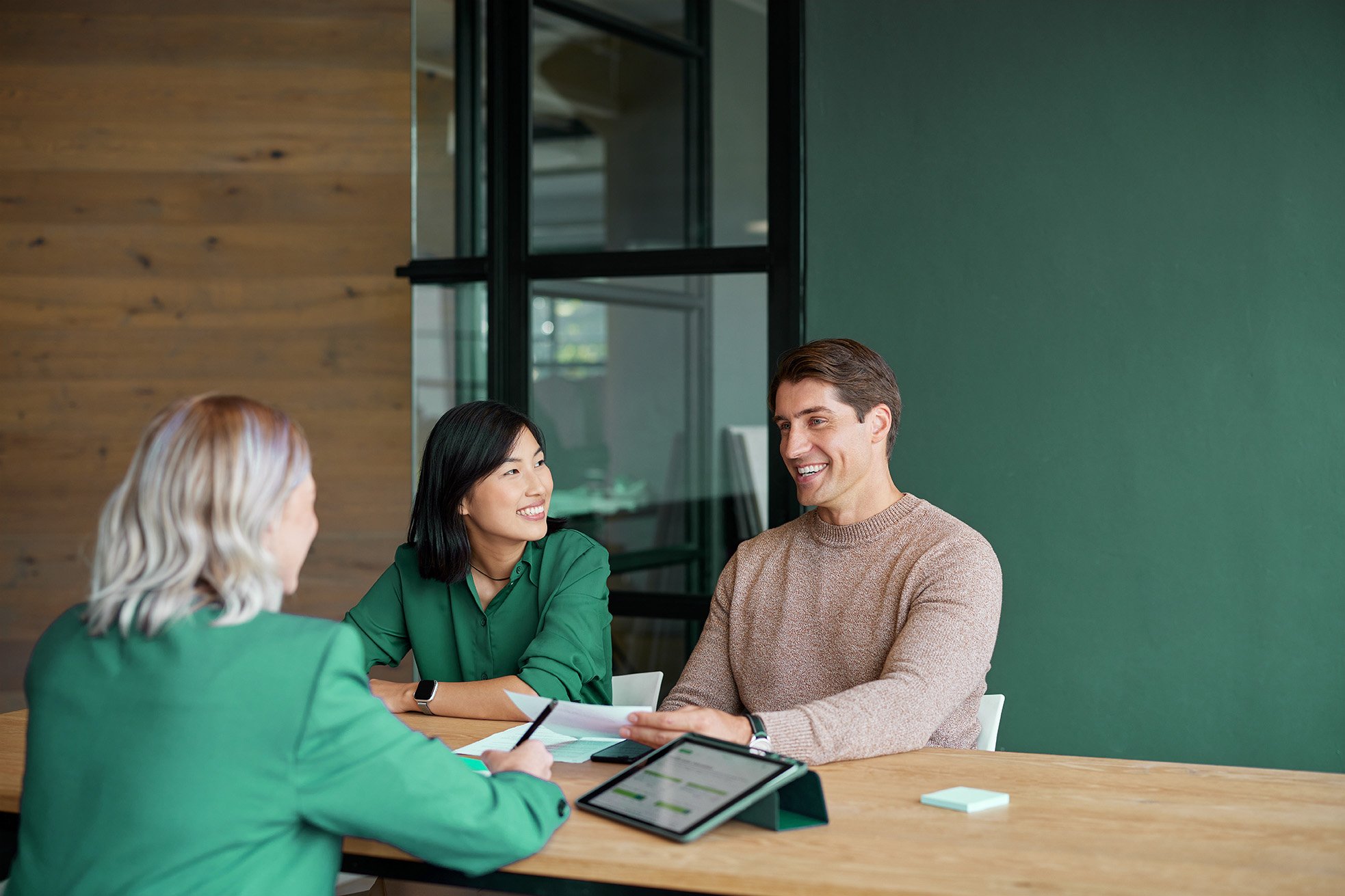Mixed race couple meeting financial advisor in office