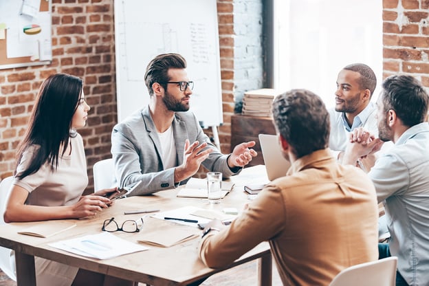 A group of coworkers making decisions in a meeting