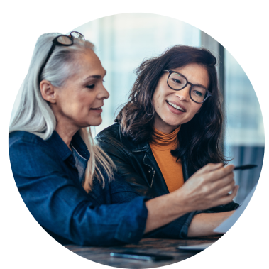 Two women in an office, sitting at a desk