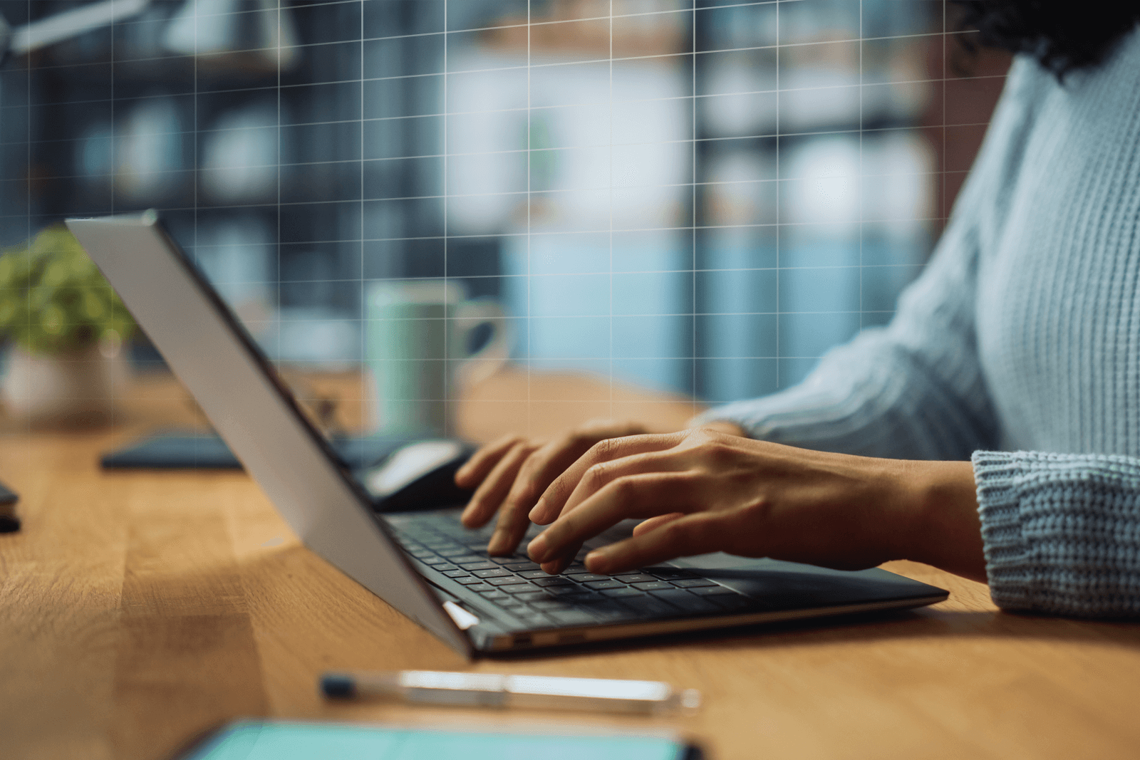 Close up of a women's hands working at her laptop