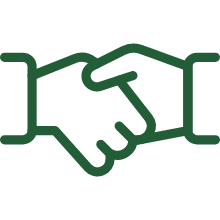 Two hands shaking in a business-like gesture, symbolizing agreement or partnership.