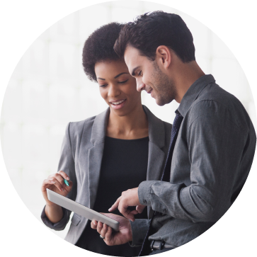 A man and a woman overlooking a document