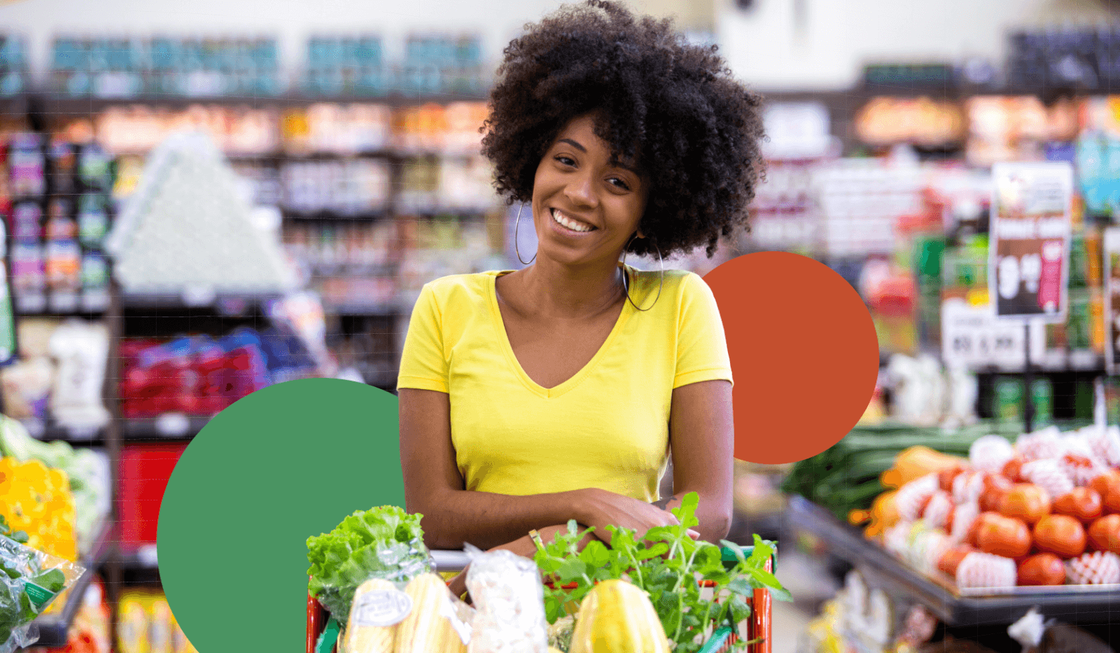A woman standing behind a shopping cart in a convenience store