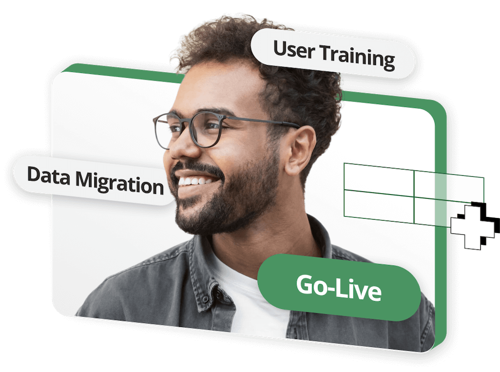 Smiling man in glasses with labels “Data Migration,” “User Training,” and “Go-Live” on a white and green graphic background.